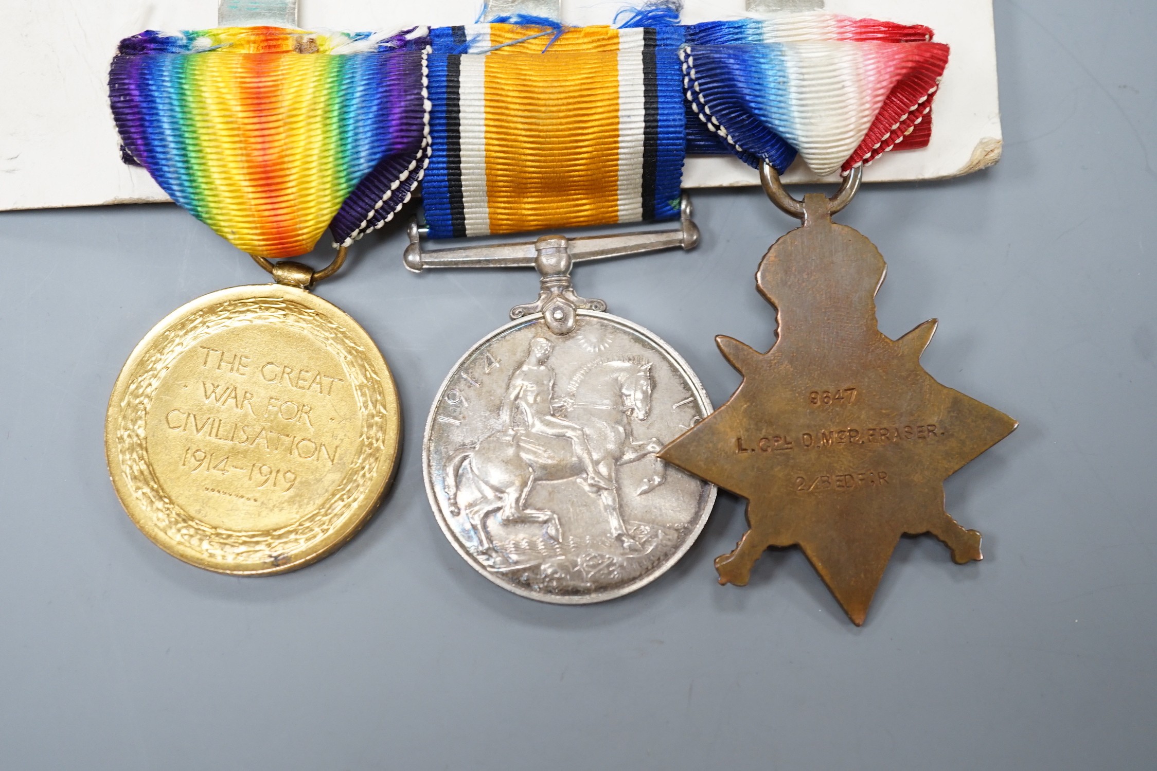 A WWI Mons star (with bar) trio possibly later named to 9647 L.CPL. D. M. FRASER